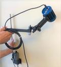 QFA001: UV lamp support, wall mount, with articulated head shown with REL Magnum UV lamp.